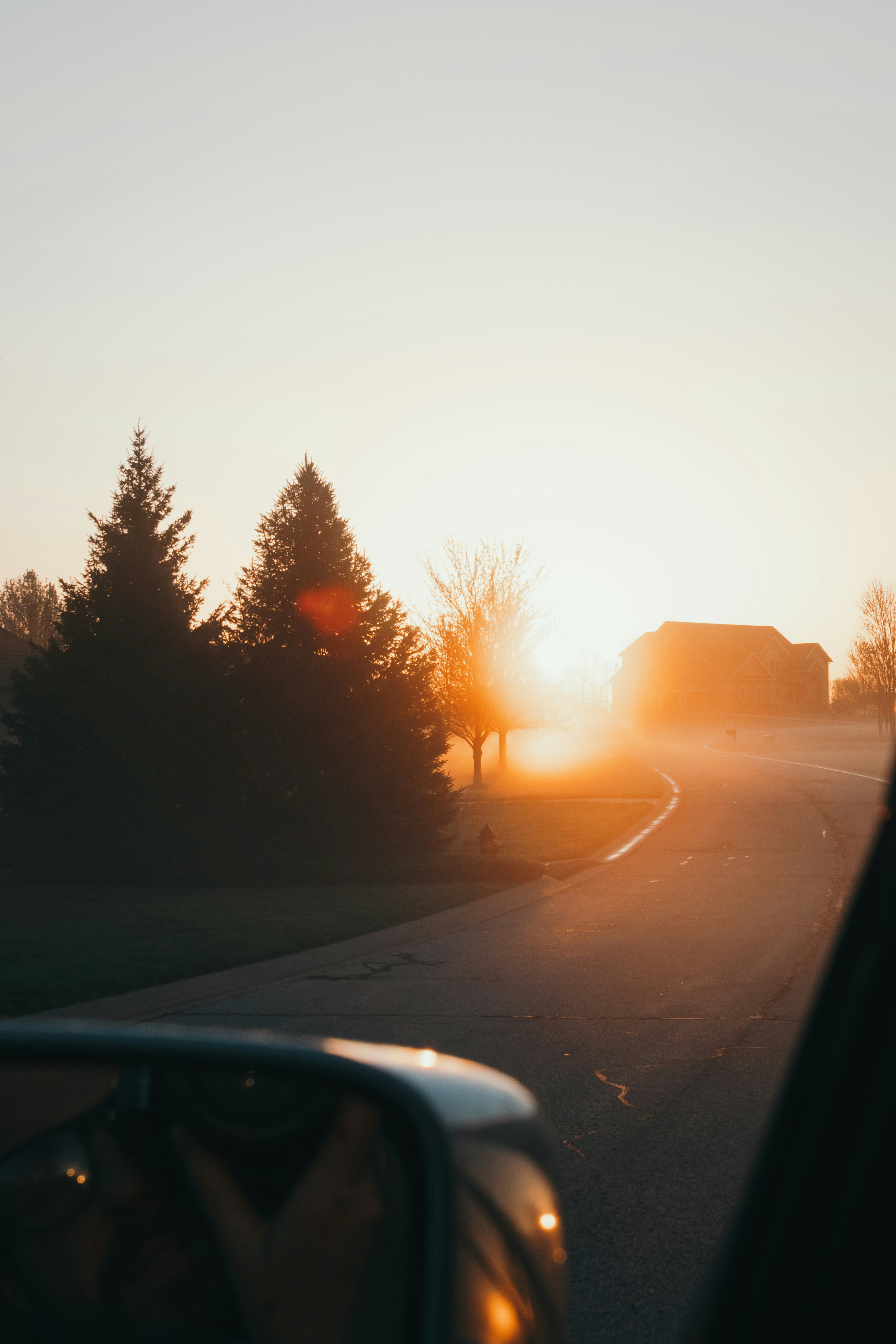 car on road during sunset